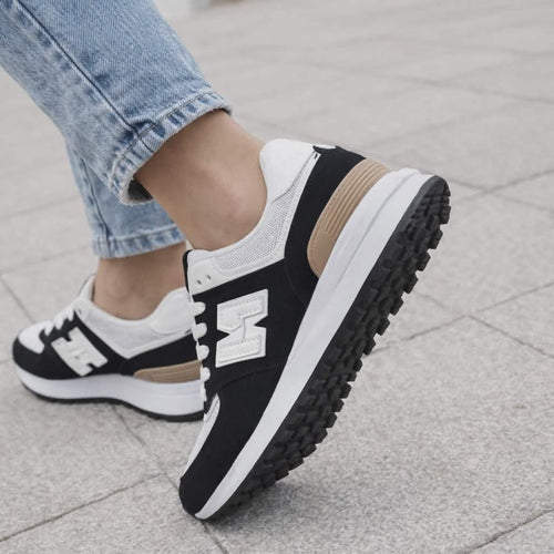 Czarne sneakersy damskie z białymi wstawkami – wygodne buty casual na co dzień