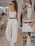 Eleganckie spodnie damskie Hermes z paskiem w kolorze ecru, luźny krój, wysoki stan, stylowy i komfortowy outfit na co dzień